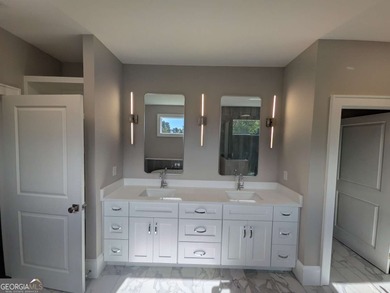 A golfer's paradise! This 4-bedroom, 3-bathroom home with 9' on Indian Creek Golf Club in Georgia - for sale on GolfHomes.com, golf home, golf lot