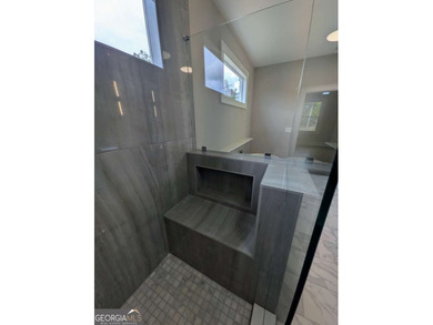 A golfer's paradise! This 4-bedroom, 3-bathroom home with 9' on Indian Creek Golf Club in Georgia - for sale on GolfHomes.com, golf home, golf lot