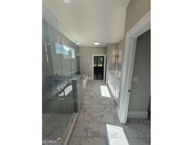 A golfer's paradise! This 4-bedroom, 3-bathroom home with 9' on Indian Creek Golf Club in Georgia - for sale on GolfHomes.com, golf home, golf lot