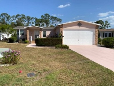 This well cared for home is furnished and includes the golf cart on Lake Fairways Country Club in Florida - for sale on GolfHomes.com, golf home, golf lot