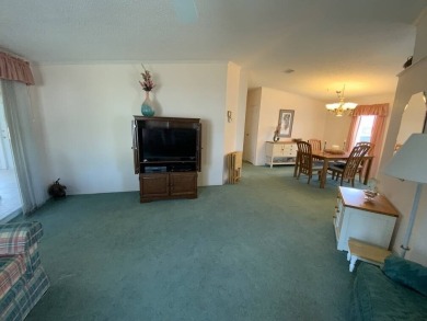 This well cared for home is furnished and includes the golf cart on Lake Fairways Country Club in Florida - for sale on GolfHomes.com, golf home, golf lot