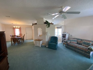 This well cared for home is furnished and includes the golf cart on Lake Fairways Country Club in Florida - for sale on GolfHomes.com, golf home, golf lot