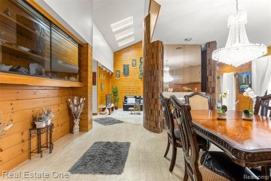 Experience refined contemporary living in this exquisite on Riverview Highlands Golf Club  in Michigan - for sale on GolfHomes.com, golf home, golf lot