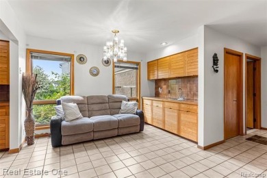 Experience refined contemporary living in this exquisite on Riverview Highlands Golf Club  in Michigan - for sale on GolfHomes.com, golf home, golf lot
