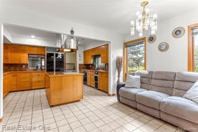 Experience refined contemporary living in this exquisite on Riverview Highlands Golf Club  in Michigan - for sale on GolfHomes.com, golf home, golf lot