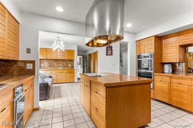 Experience refined contemporary living in this exquisite on Riverview Highlands Golf Club  in Michigan - for sale on GolfHomes.com, golf home, golf lot
