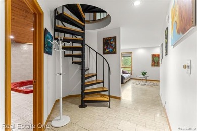 Experience refined contemporary living in this exquisite on Riverview Highlands Golf Club  in Michigan - for sale on GolfHomes.com, golf home, golf lot