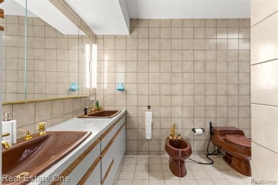 Experience refined contemporary living in this exquisite on Riverview Highlands Golf Club  in Michigan - for sale on GolfHomes.com, golf home, golf lot