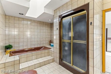 Experience refined contemporary living in this exquisite on Riverview Highlands Golf Club  in Michigan - for sale on GolfHomes.com, golf home, golf lot