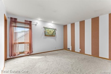 Experience refined contemporary living in this exquisite on Riverview Highlands Golf Club  in Michigan - for sale on GolfHomes.com, golf home, golf lot