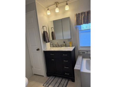 This lovely, manufactured home is in Lake Fairways Country Club on Pine Lakes Country Club in Florida - for sale on GolfHomes.com, golf home, golf lot