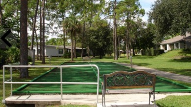 This lovely, manufactured home is in Lake Fairways Country Club on Pine Lakes Country Club in Florida - for sale on GolfHomes.com, golf home, golf lot