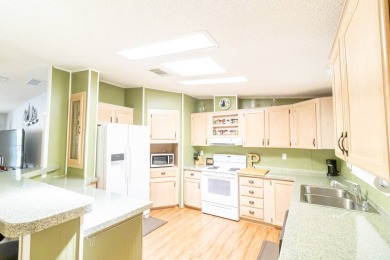 Welcome to 4603 Delmar Dr, a three-bedroom, two-bathroom on Schalamar Creek Golf and Country Club in Florida - for sale on GolfHomes.com, golf home, golf lot