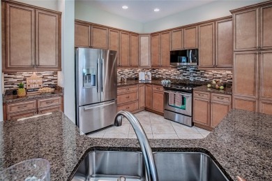 Welcome to Your Dream Retreat with this Aspen designer model on Egret Championship Golf Course in Florida - for sale on GolfHomes.com, golf home, golf lot