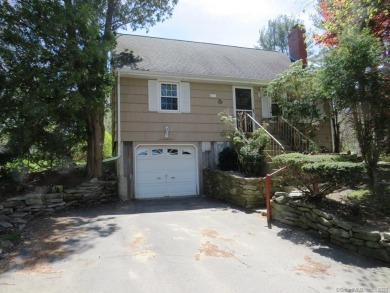 COME SEE THIS 1960 CAPE WITH 4  ROOMS ON FIRST FLOOR WITH  A on Tallwood Country Club in Connecticut - for sale on GolfHomes.com, golf home, golf lot