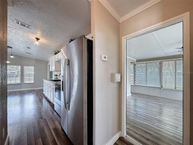 NO LOT RENT, it is a deeded lot, 2 bedrooms 1 Bath. A/C 2018 and on Glen Lakes Country Club in Florida - for sale on GolfHomes.com, golf home, golf lot