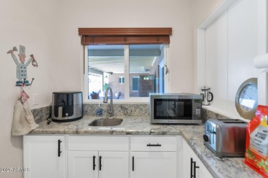 Discover this meticulously 4 bed, 3.5 bath custom home on a on Mesa Country Club in Arizona - for sale on GolfHomes.com, golf home, golf lot