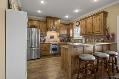 Welcome to your dream home in the charming, gated community of on Mount Pleasant Country Club in Texas - for sale on GolfHomes.com, golf home, golf lot