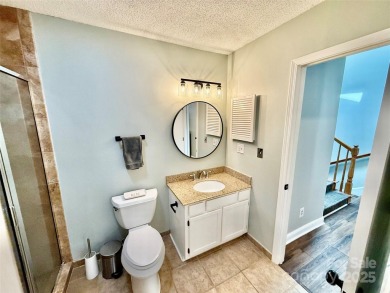 Newly renovated with brand new furnishings, fresh interior paint on Rumbling Bald Resort on Lake Lure in North Carolina - for sale on GolfHomes.com, golf home, golf lot