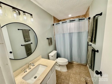 Newly renovated with brand new furnishings, fresh interior paint on Rumbling Bald Resort on Lake Lure in North Carolina - for sale on GolfHomes.com, golf home, golf lot