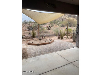 This spacious 4-bedroom, 2-bathroom home offers plenty of living on Gold Canyon Golf Resort - Sidewinder in Arizona - for sale on GolfHomes.com, golf home, golf lot