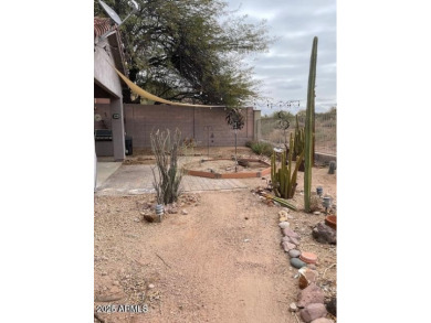 This spacious 4-bedroom, 2-bathroom home offers plenty of living on Gold Canyon Golf Resort - Sidewinder in Arizona - for sale on GolfHomes.com, golf home, golf lot