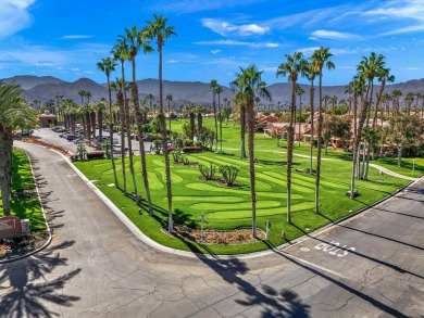 The charming courtyard gracefully lures you into this spacious on Oasis Country Club in California - for sale on GolfHomes.com, golf home, golf lot