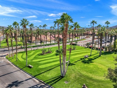 The charming courtyard gracefully lures you into this spacious on Oasis Country Club in California - for sale on GolfHomes.com, golf home, golf lot