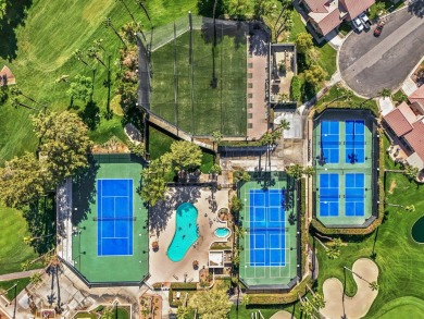 The charming courtyard gracefully lures you into this spacious on Oasis Country Club in California - for sale on GolfHomes.com, golf home, golf lot