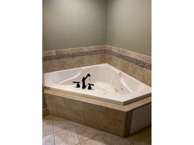 Experience luxury mountain living at its finest in this elegant on Gatlinburg Golf Course in Tennessee - for sale on GolfHomes.com, golf home, golf lot