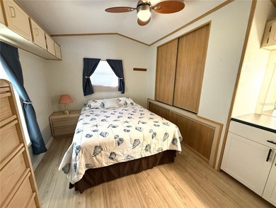 TWO BEDROOM, TWO BATHROOM MOBILE HOME IN ACTIVE 55+ COMMUNITY on River Run Golf Links in Florida - for sale on GolfHomes.com, golf home, golf lot