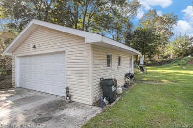 This 2 story colonial on a quarter acre comes with access/lake on Rush Lake Hills Golf Club in Michigan - for sale on GolfHomes.com, golf home, golf lot