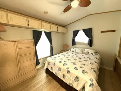 TWO BEDROOM, TWO BATHROOM MOBILE HOME IN ACTIVE 55+ COMMUNITY on River Run Golf Links in Florida - for sale on GolfHomes.com, golf home, golf lot