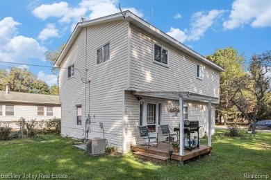 This 2 story colonial on a quarter acre comes with access/lake on Rush Lake Hills Golf Club in Michigan - for sale on GolfHomes.com, golf home, golf lot