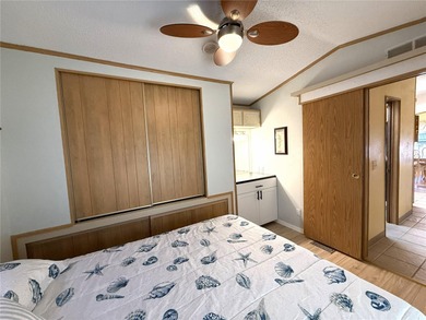 TWO BEDROOM, TWO BATHROOM MOBILE HOME IN ACTIVE 55+ COMMUNITY on River Run Golf Links in Florida - for sale on GolfHomes.com, golf home, golf lot