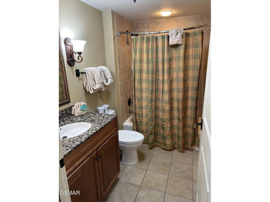 Experience luxury mountain living at its finest in this elegant on Gatlinburg Golf Course in Tennessee - for sale on GolfHomes.com, golf home, golf lot