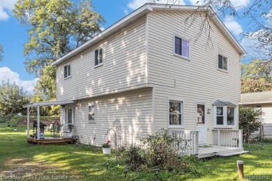 This 2 story colonial on a quarter acre comes with access/lake on Rush Lake Hills Golf Club in Michigan - for sale on GolfHomes.com, golf home, golf lot