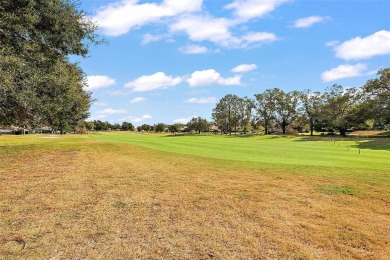 This 3-bedroom former model home sits on Hole 2 of Harbor Hills on Harbor Hills Country Club in Florida - for sale on GolfHomes.com, golf home, golf lot