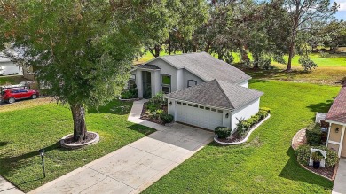 This 3-bedroom former model home sits on Hole 2 of Harbor Hills on Harbor Hills Country Club in Florida - for sale on GolfHomes.com, golf home, golf lot