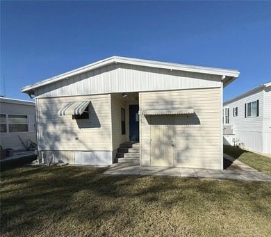 TWO BEDROOM, TWO BATHROOM MOBILE HOME IN ACTIVE 55+ COMMUNITY on River Run Golf Links in Florida - for sale on GolfHomes.com, golf home, golf lot