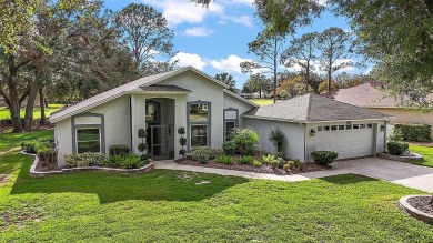 This 3-bedroom former model home sits on Hole 2 of Harbor Hills on Harbor Hills Country Club in Florida - for sale on GolfHomes.com, golf home, golf lot