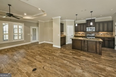 THIS SPACIOUS FOUR-BEDROOM HOME OFFERS OVER 2,700 SQUARE FEET OF on Laurel Island Links in Georgia - for sale on GolfHomes.com, golf home, golf lot