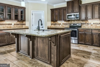 THIS SPACIOUS FOUR-BEDROOM HOME OFFERS OVER 2,700 SQUARE FEET OF on Laurel Island Links in Georgia - for sale on GolfHomes.com, golf home, golf lot
