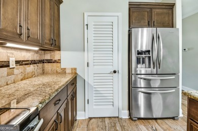 THIS SPACIOUS FOUR-BEDROOM HOME OFFERS OVER 2,700 SQUARE FEET OF on Laurel Island Links in Georgia - for sale on GolfHomes.com, golf home, golf lot