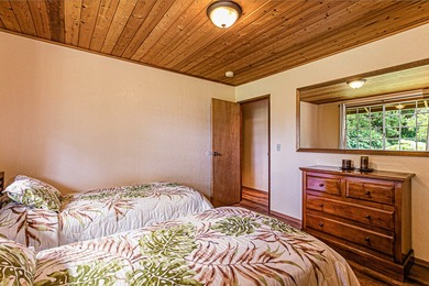 This recently remodeled two bedroom, two bath cabin is a on Volcano Golf and Country Club in Hawaii - for sale on GolfHomes.com, golf home, golf lot