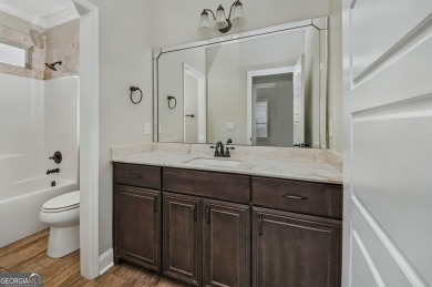 THIS SPACIOUS FOUR-BEDROOM HOME OFFERS OVER 2,700 SQUARE FEET OF on Laurel Island Links in Georgia - for sale on GolfHomes.com, golf home, golf lot