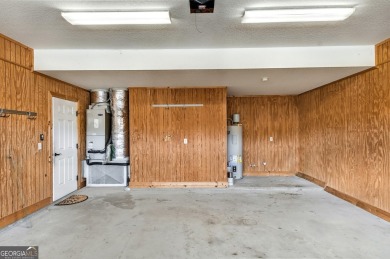 THIS SPACIOUS FOUR-BEDROOM HOME OFFERS OVER 2,700 SQUARE FEET OF on Laurel Island Links in Georgia - for sale on GolfHomes.com, golf home, golf lot