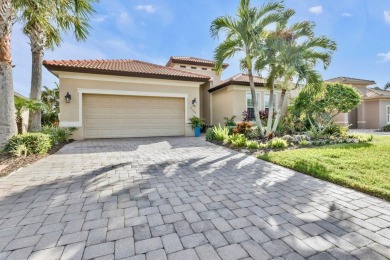 Resort-Style Living Awaits in This Stunning Waterfront Home! on Riverwood Golf Club in Florida - for sale on GolfHomes.com, golf home, golf lot