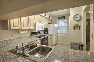 Enjoy maintenance-free living in this beautifully furnished on  in Florida - for sale on GolfHomes.com, golf home, golf lot