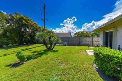 RARE HALF DUPLEX WITH PRIVATE BACKYARD! This 2-bedroom on Cypress Lakes Golf Course - West Palm Beach in Florida - for sale on GolfHomes.com, golf home, golf lot